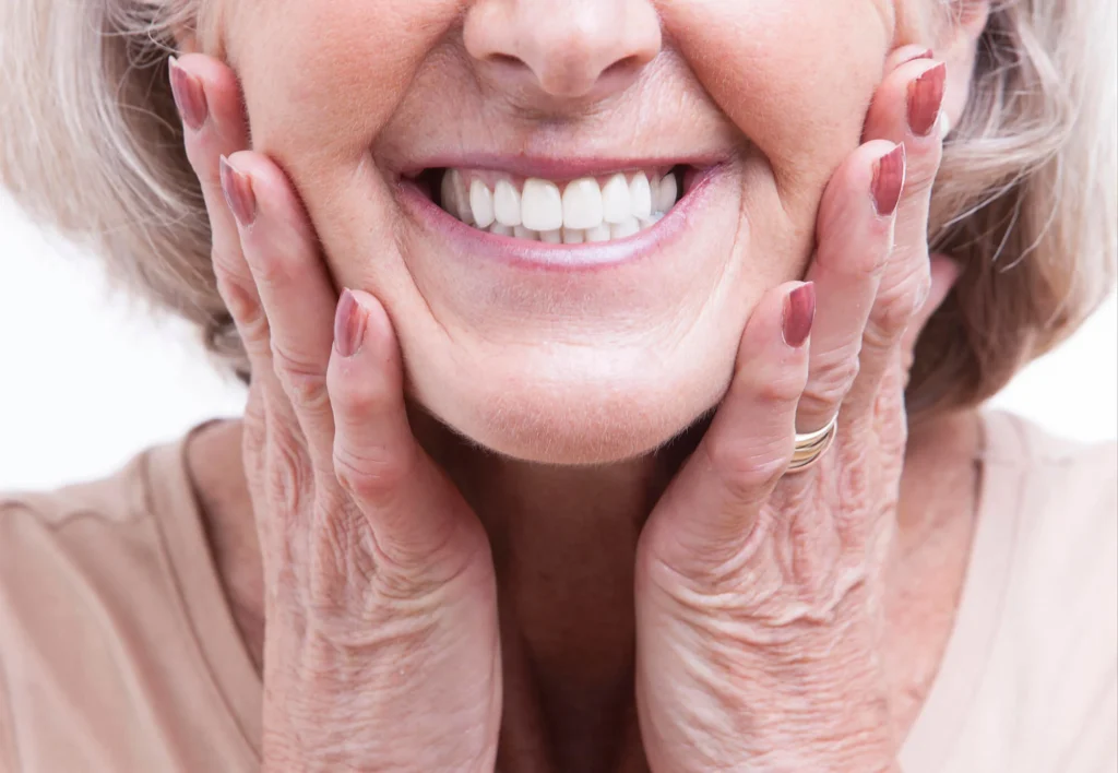 Elderly woman showing her bright dentures dr murphy dentist