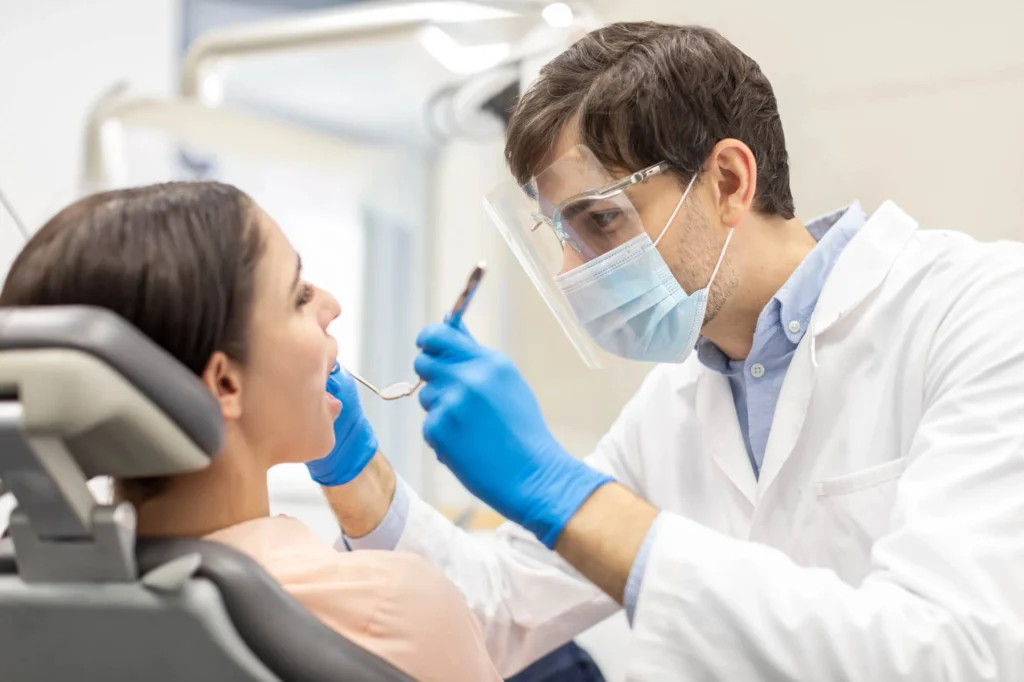 Patient dental exam with caring team — Dentist in Upper East Side