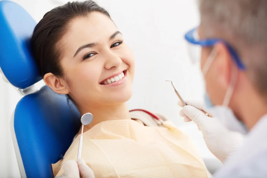 Patient getting a checkup from a dentist in Upper East Side.
