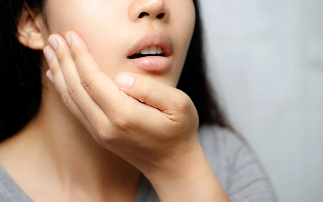 woman in pain before going to an emergency dentist in Upper East Side